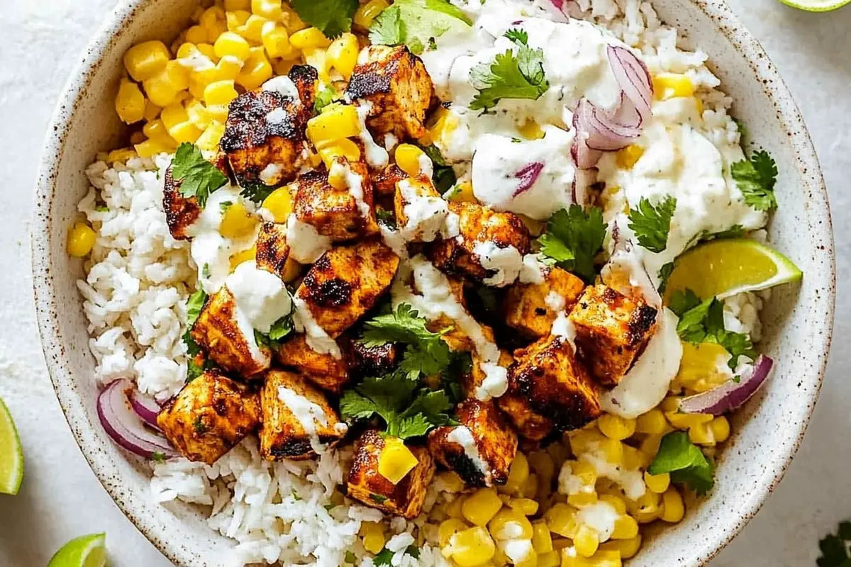 Street Corn Chicken Rice Bowl with fresh cilantro and cotija cheese